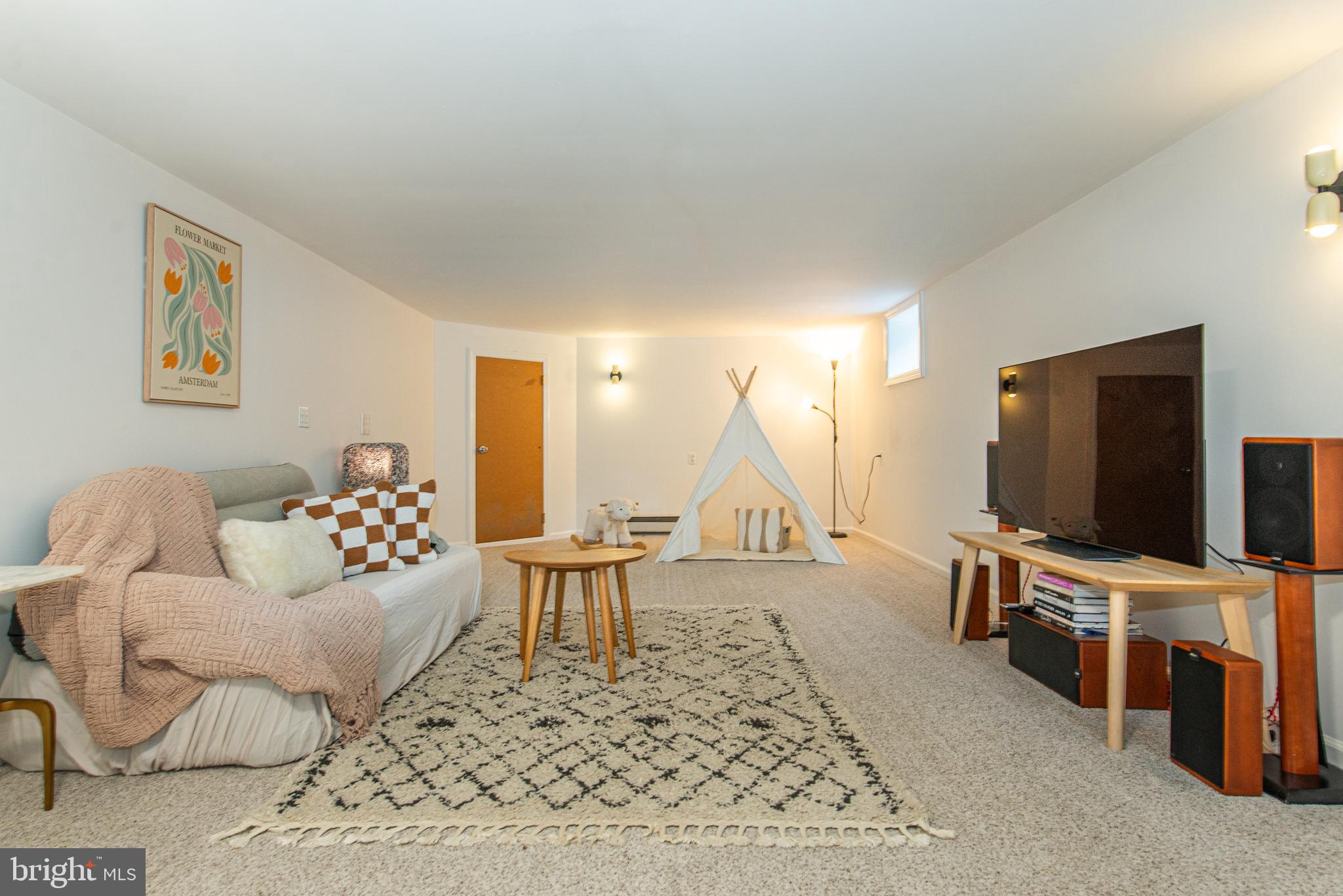 229 South Main Street Pennington, NJ 08534 - Photo 31 of 36 a living room with furniture and a flat screen tv