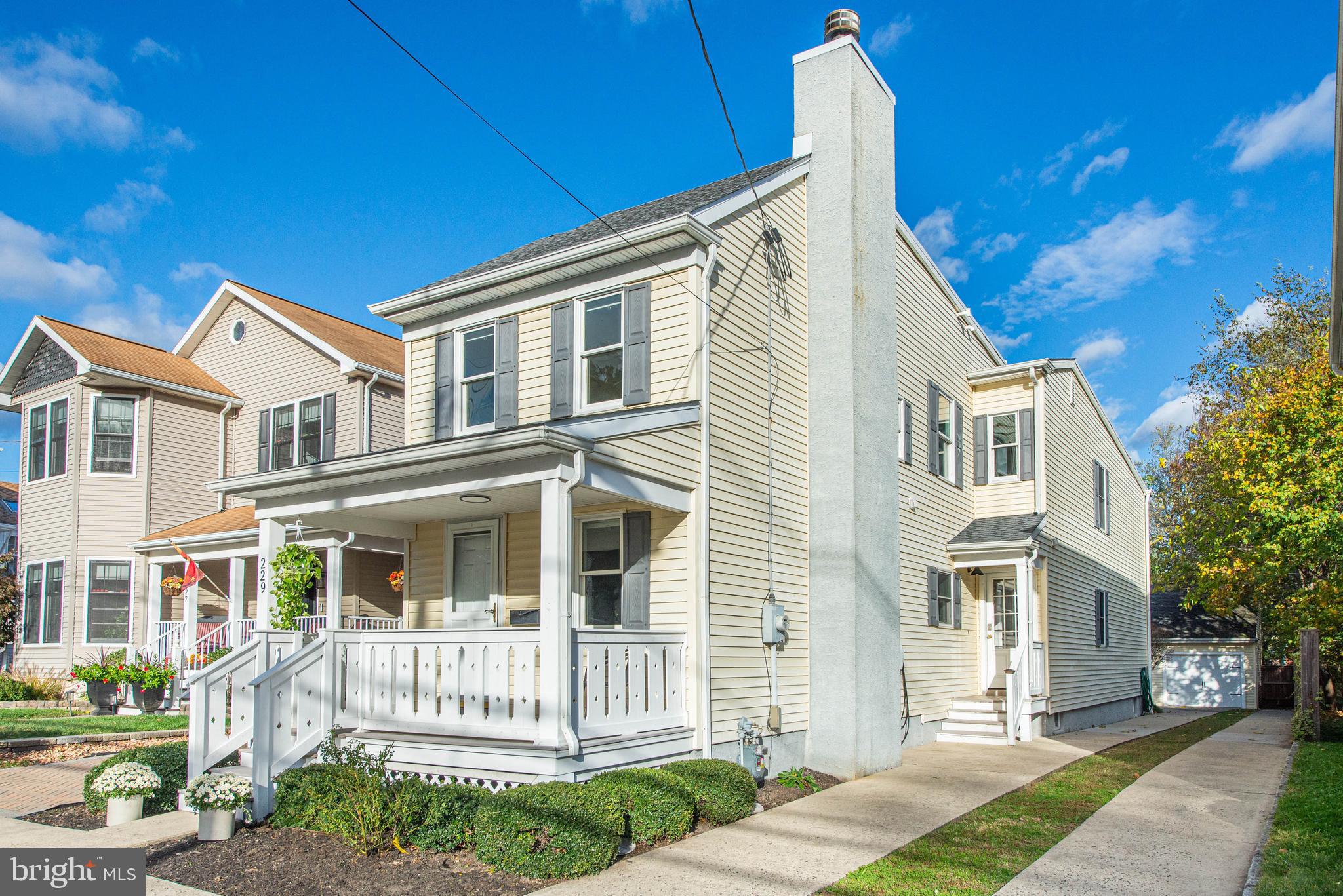 229 South Main Street Pennington, NJ 08534 - Photo 4 of 36 a front view of a house with a garden