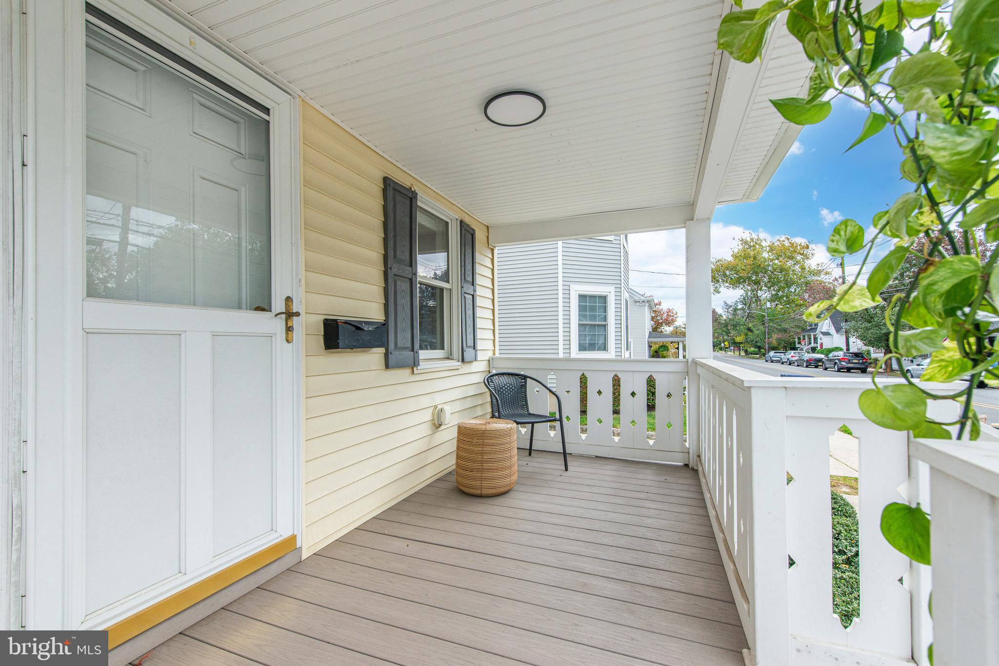 229 South Main Street Pennington, NJ 08534 - Photo 5 of 36 a view of a deck with chair and wooden door