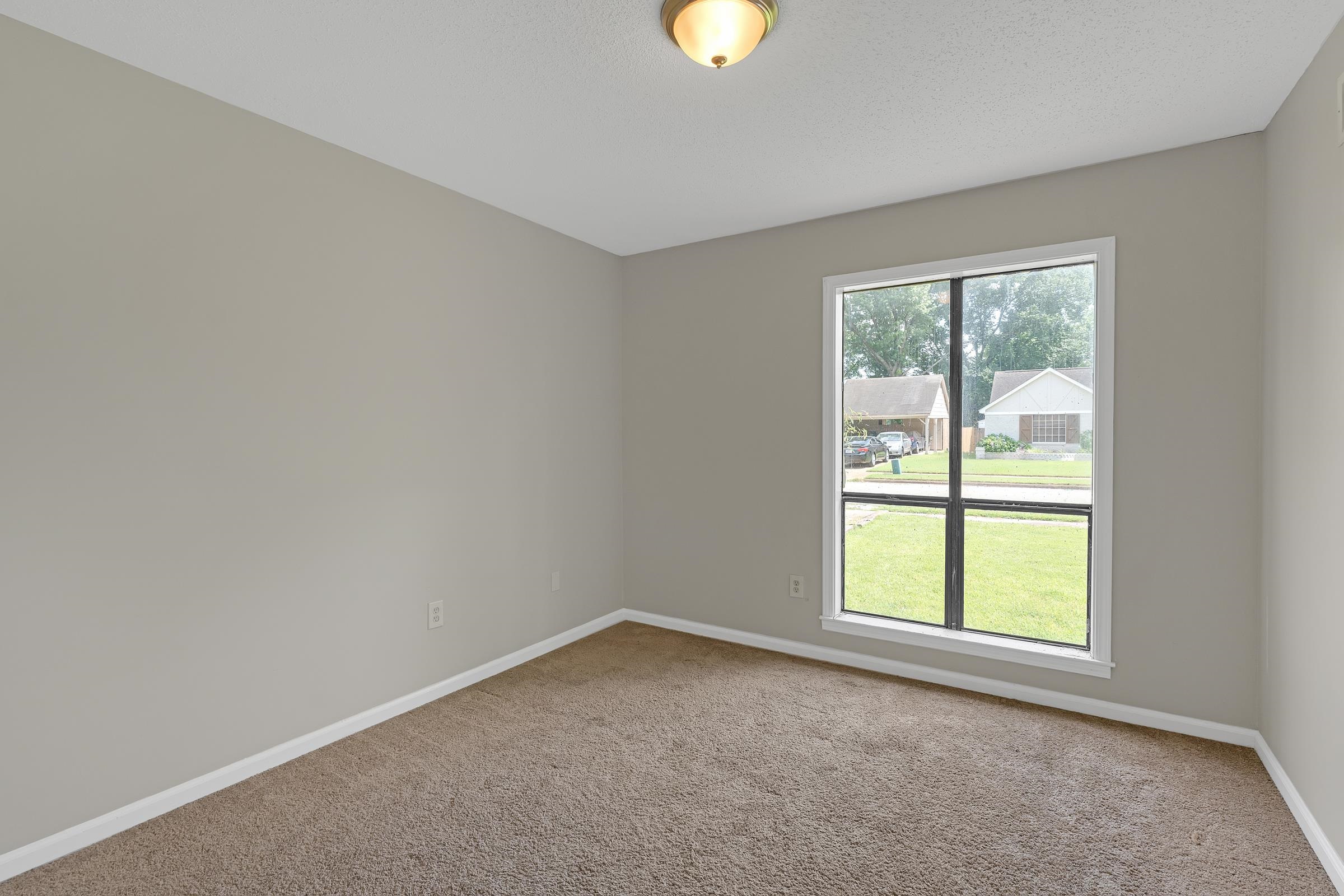 6128 Raintree Drive Memphis, TN 38115 - Photo 18 of 30 an empty room with windows