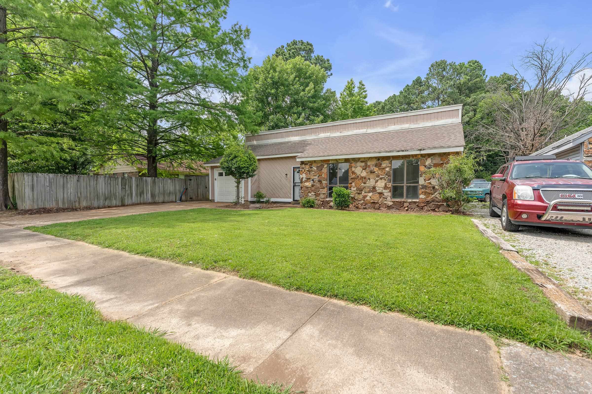 6128 Raintree Drive Memphis, TN 38115 - Photo 30 of 30 a view of a yard with a house and a park