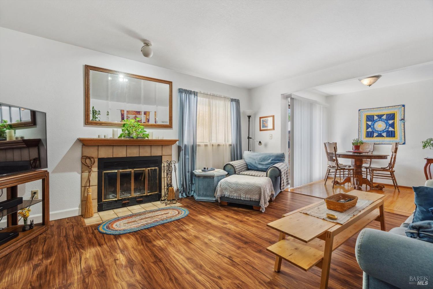 4205 Sonoma Highway Santa Rosa, CA 95409 - Photo 1 of 1 a living room with furniture and a wooden floor