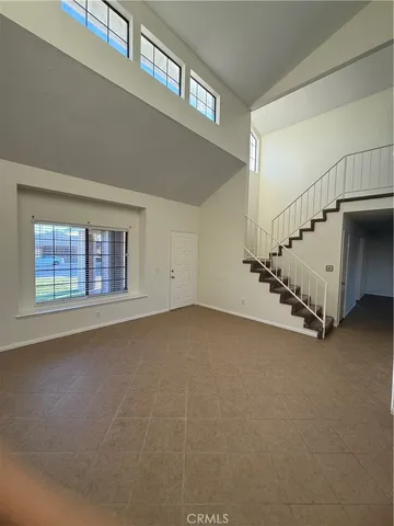 a view of an empty room with windows