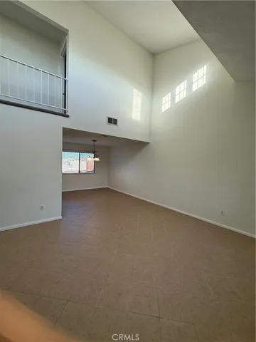 a view of empty room with windows