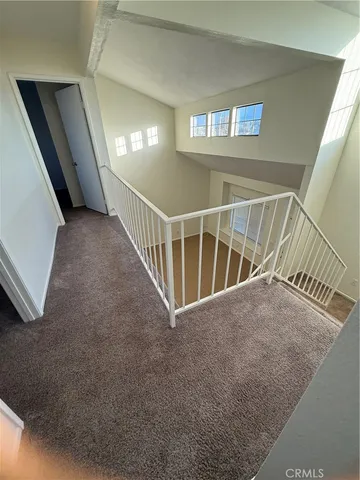 a view of staircase and hallway
