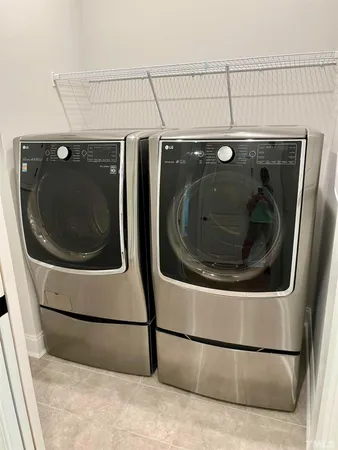 a utility room with dryer and washer