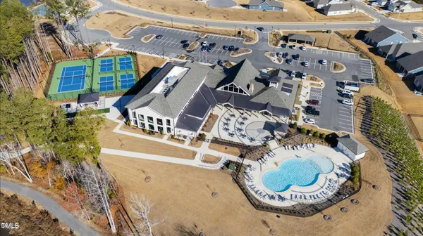 an aerial view of a house with a swimming pool