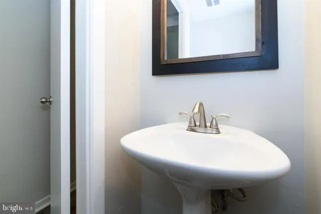 a close view of a sink and a microwave