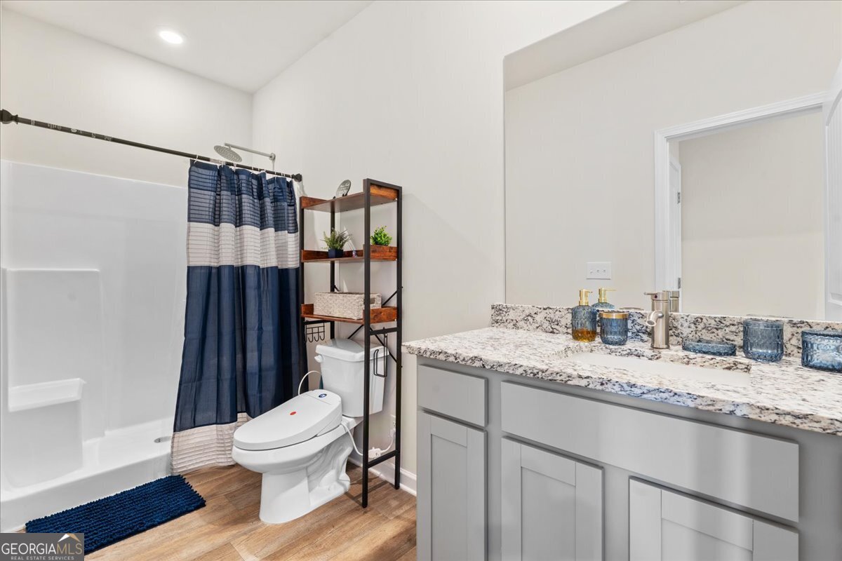 104 Red Barn Court Perry, GA 31069 - Photo 11 of 31 a bathroom with a granite countertop sink toilet and shower
