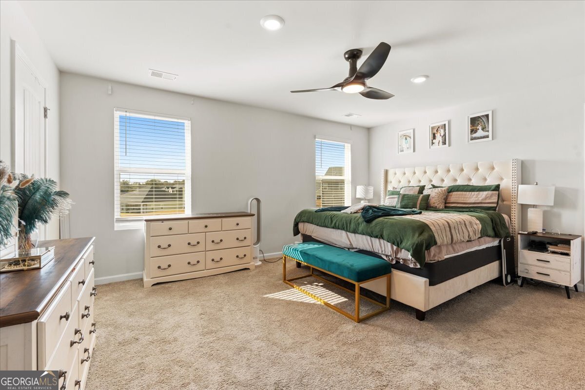 104 Red Barn Court Perry, GA 31069 - Photo 17 of 31 a bedroom with a bed and a window