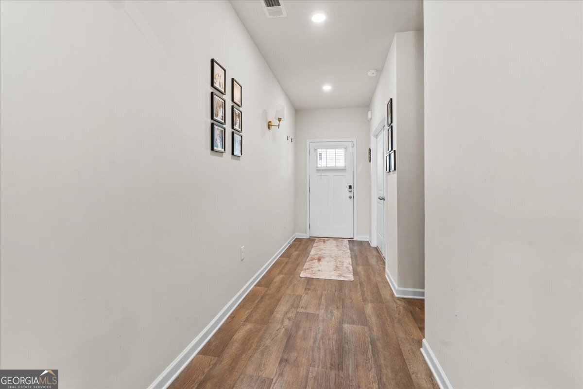 104 Red Barn Court Perry, GA 31069 - Photo 2 of 31 a view of a hallway with wooden floor
