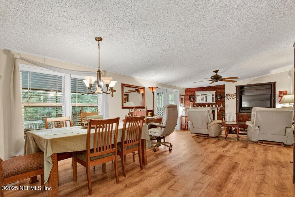 695 Carlin Road Satsuma, FL 32189 - Photo 14 of 53 a view of a livingroom with furniture window and wooden floor