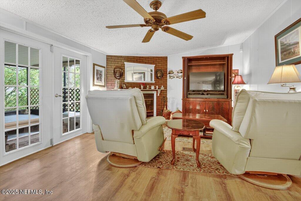 695 Carlin Road Satsuma, FL 32189 - Photo 15 of 53 a living room with furniture and a wooden floor