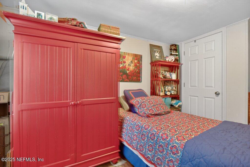 695 Carlin Road Satsuma, FL 32189 - Photo 26 of 53 a bedroom with a bed and a window