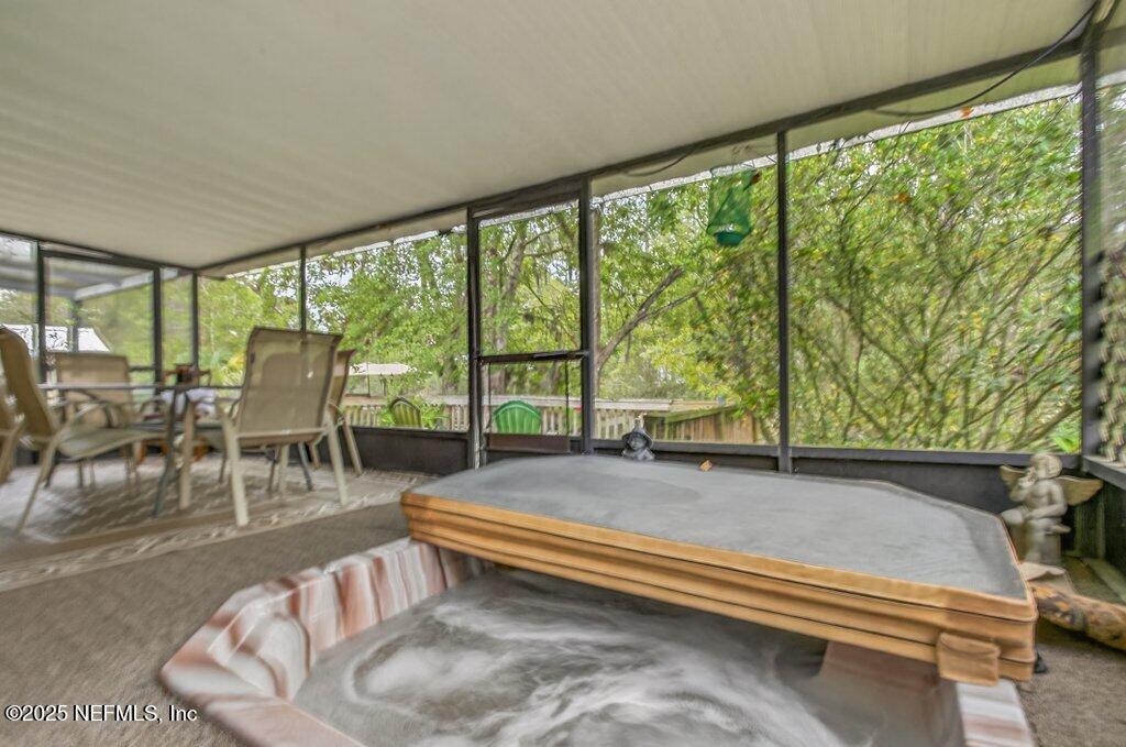 695 Carlin Road Satsuma, FL 32189 - Photo 27 of 53 a living room with furniture and a large window