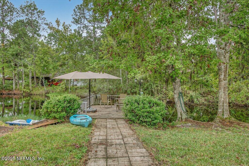 695 Carlin Road Satsuma, FL 32189 - Photo 35 of 53 a view of a backyard with sitting area