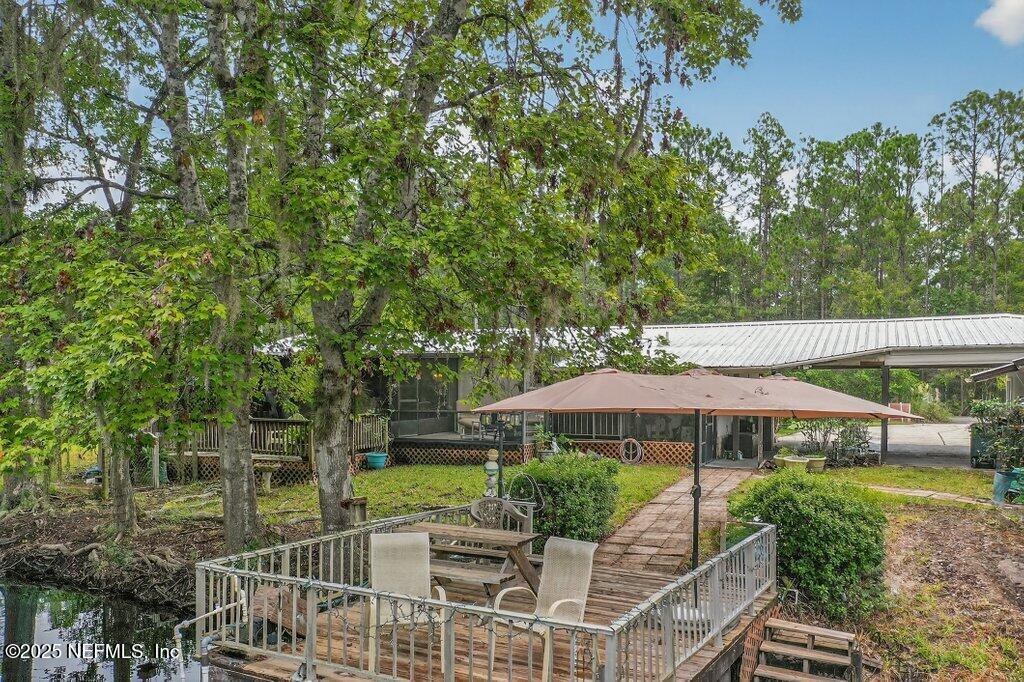 695 Carlin Road Satsuma, FL 32189 - Photo 39 of 53 an outdoor space with patio and umbrella