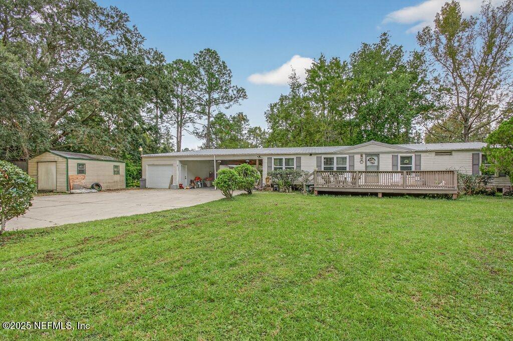 695 Carlin Road Satsuma, FL 32189 - Photo 4 of 53 a view of a house with a backyard