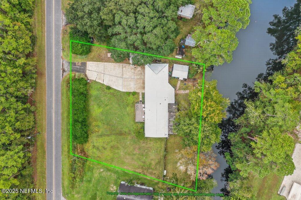 695 Carlin Road Satsuma, FL 32189 - Photo 44 of 53 an aerial view of a residential houses with yard