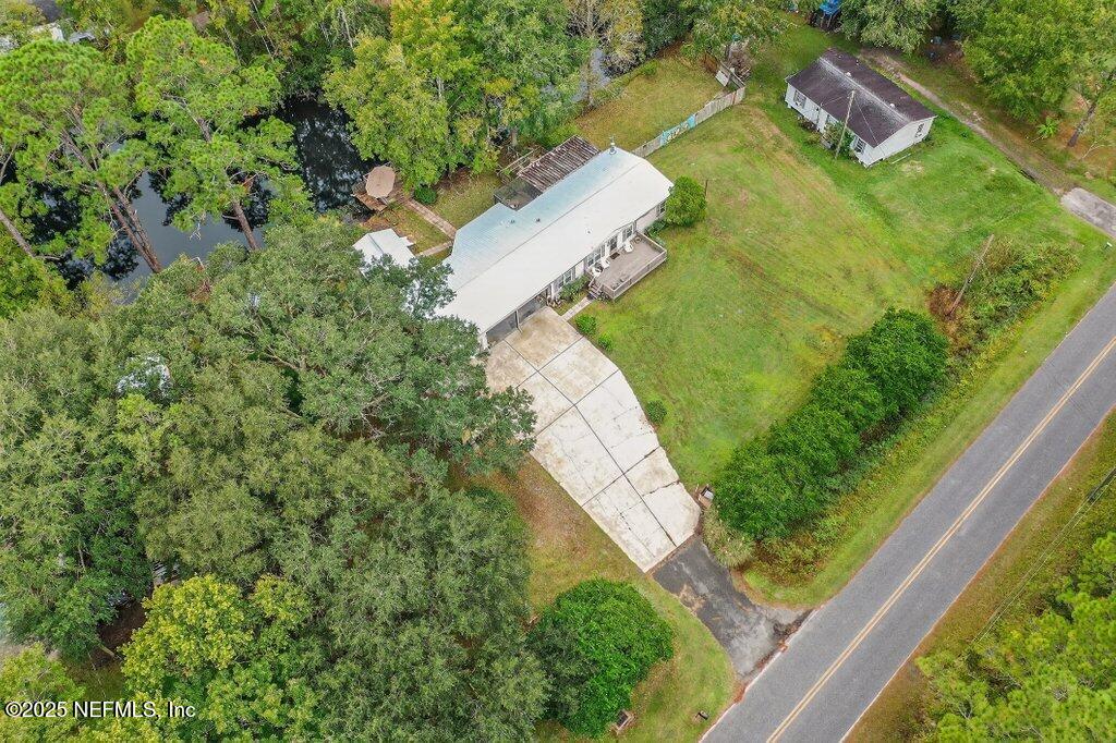 695 Carlin Road Satsuma, FL 32189 - Photo 50 of 53 a view of a yard with yellow