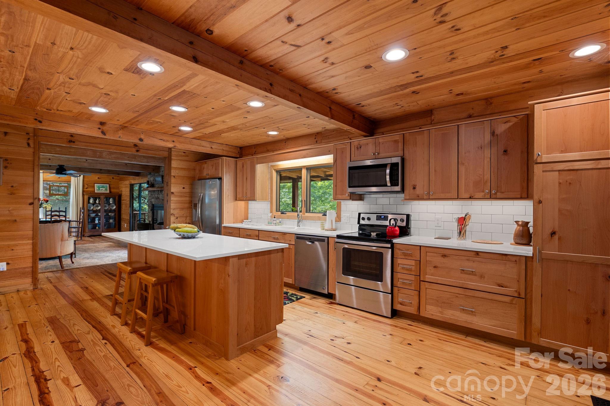 150 Avondale Ridge Road Asheville, NC 28803 - Photo 11 of 45 a kitchen with stove and cabinets