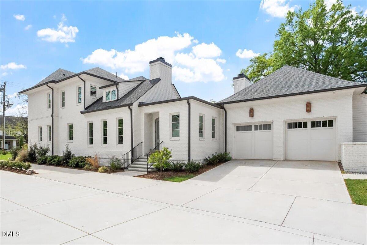 2123 St Marys Street Raleigh, NC 27608 - Photo 67 of 77 a front view of a house with garden