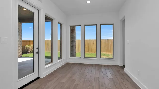 a porch with a table and chairs