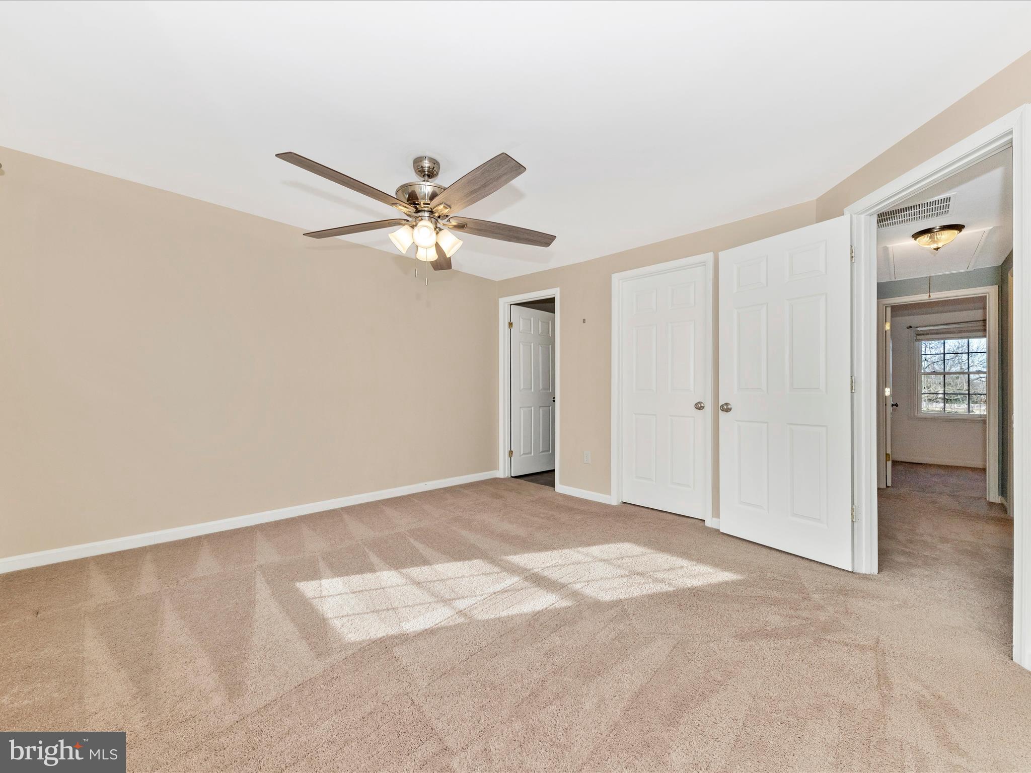 17634 Kohlhoss Road Poolesville, MD 20837 - Photo 22 of 44 an empty room with fan and windows