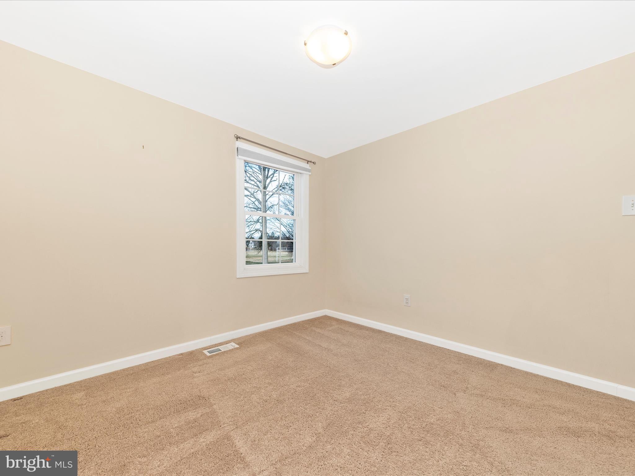 17634 Kohlhoss Road Poolesville, MD 20837 - Photo 25 of 44 an empty room with windows