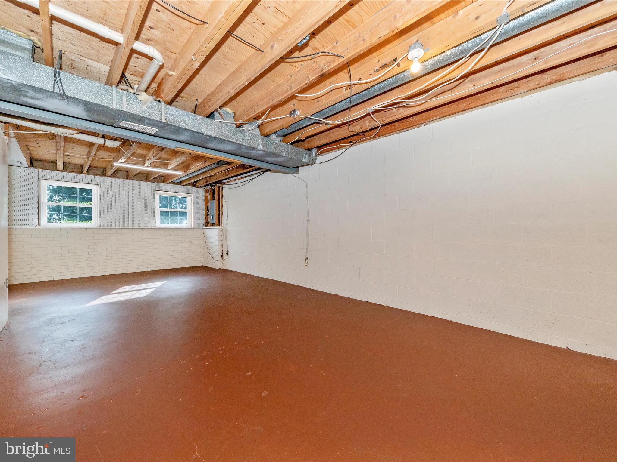 17634 Kohlhoss Road Poolesville, MD 20837 - Photo 34 of 44 a view of a room with wooden floor and windows