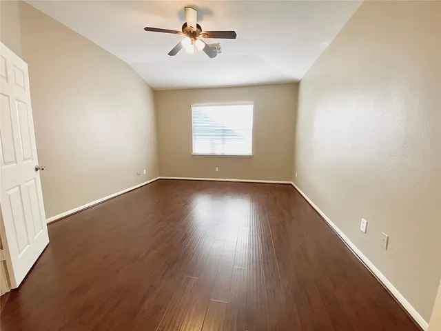 a view of room window and wooden floor