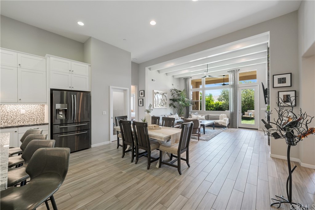 35162 Ladybug Lane Murrieta, CA 92563 - Photo 16 of 58 a dining room with furniture and wooden floor