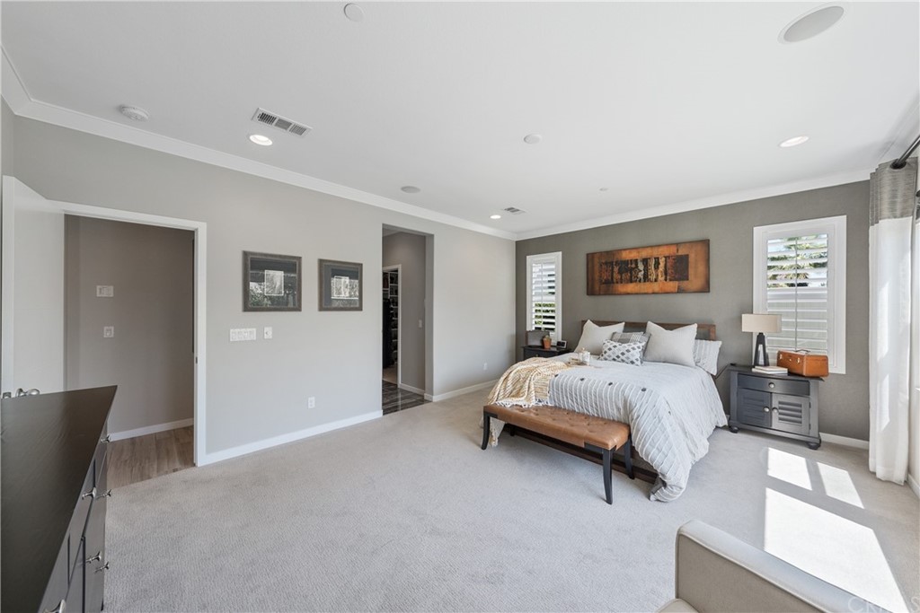 35162 Ladybug Lane Murrieta, CA 92563 - Photo 22 of 58 a spacious bedroom with a bed couch and window