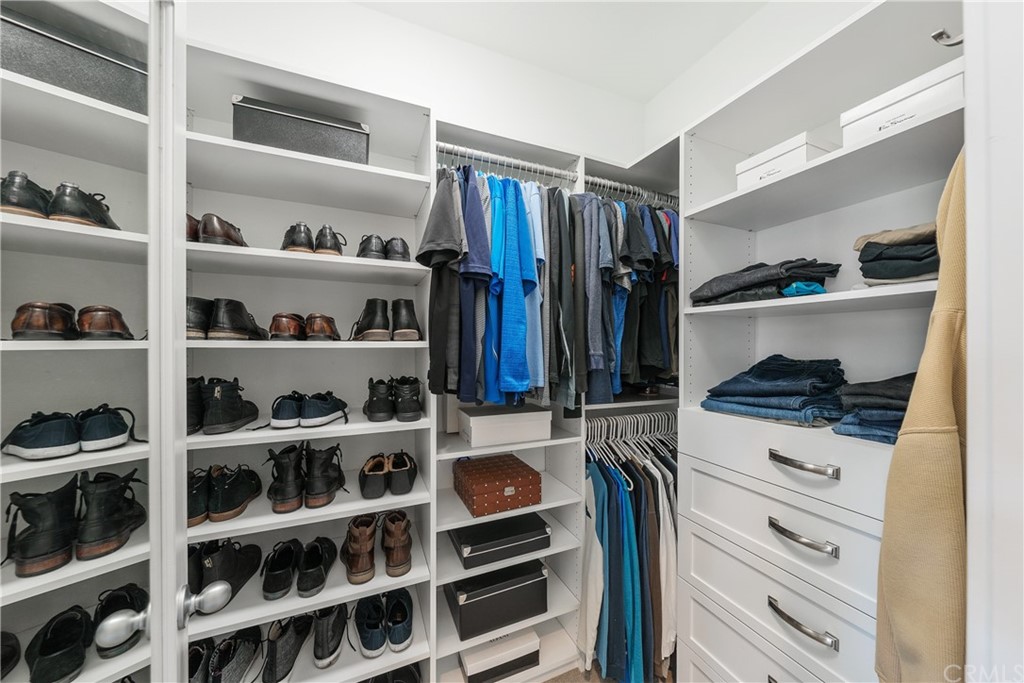 35162 Ladybug Lane Murrieta, CA 92563 - Photo 24 of 58 a view of walk in closet with clothes and shoes