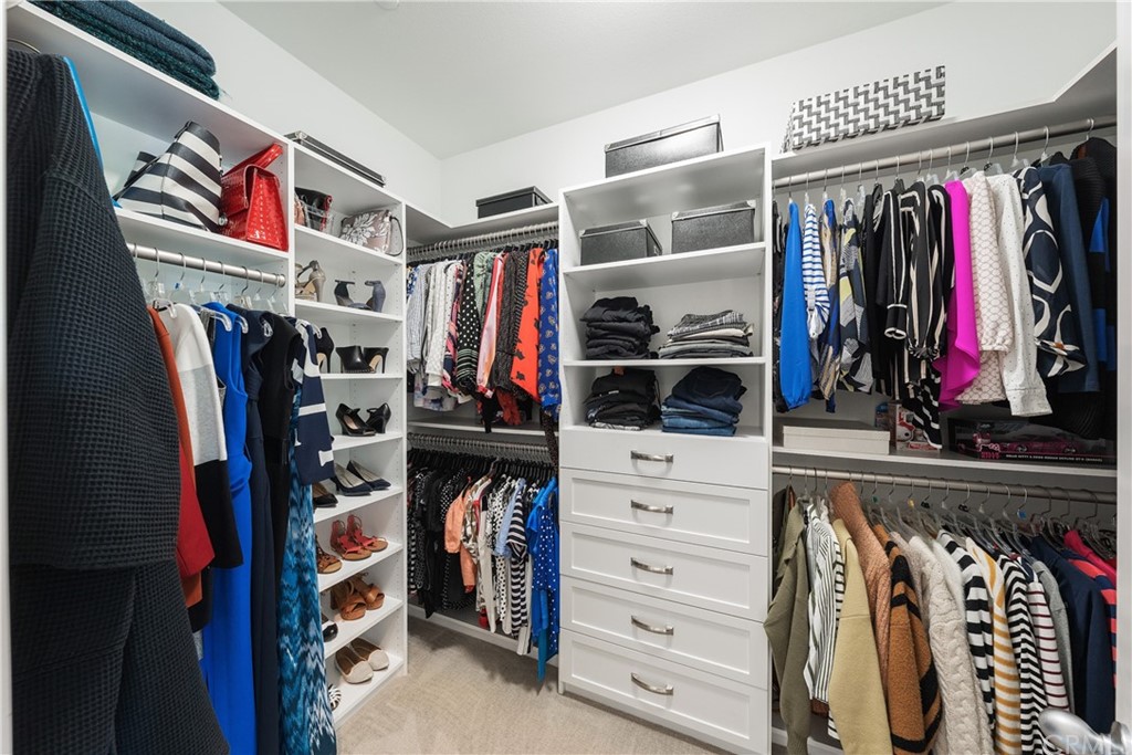 35162 Ladybug Lane Murrieta, CA 92563 - Photo 25 of 58 a view of walk in closet with clothes