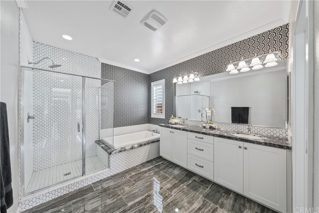 35162 Ladybug Lane Murrieta, CA 92563 - Photo 26 of 58 a spacious bathroom with a double vanity sink mirror and shower