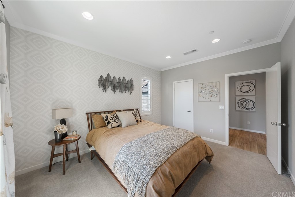 35162 Ladybug Lane Murrieta, CA 92563 - Photo 29 of 58 a spacious bedroom with a bed and a table in it
