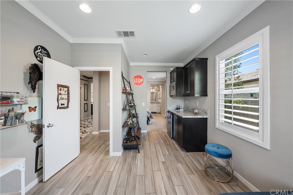 35162 Ladybug Lane Murrieta, CA 92563 - Photo 33 of 58 a kitchen with stainless steel appliances a stove top oven a sink and a refrigerator
