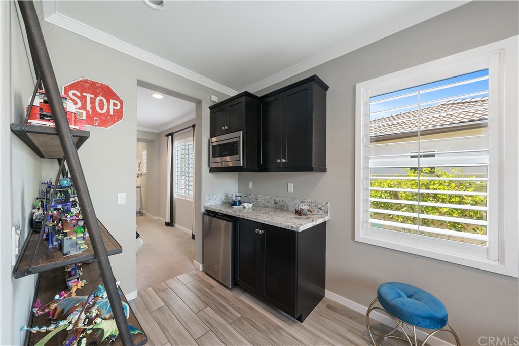35162 Ladybug Lane Murrieta, CA 92563 - Photo 34 of 58 a view of a kitchen with fridge and workspace