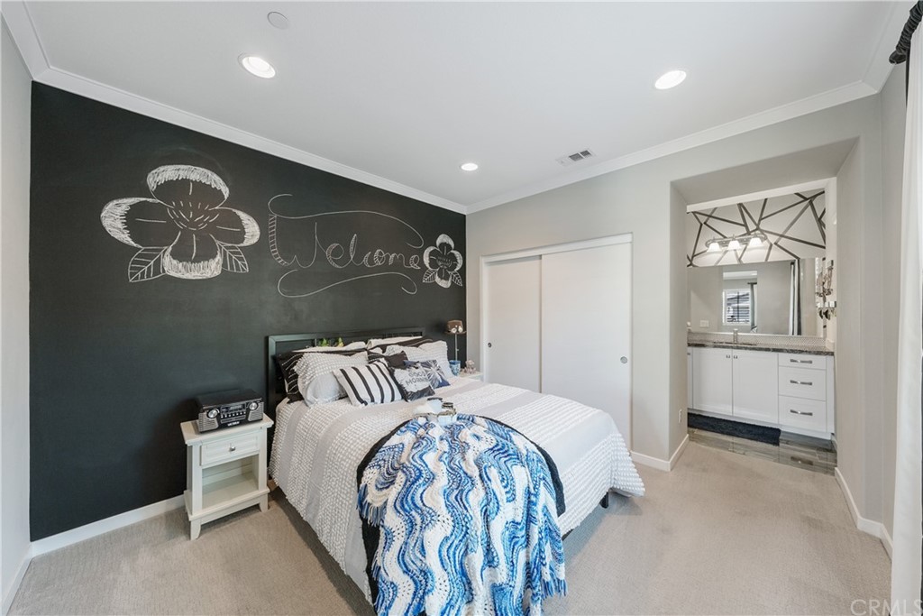 35162 Ladybug Lane Murrieta, CA 92563 - Photo 35 of 58 a bedroom with a large bed and a table