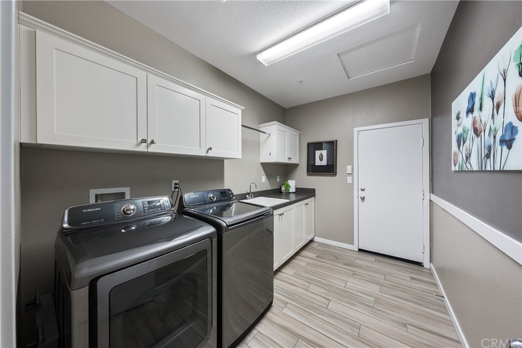 35162 Ladybug Lane Murrieta, CA 92563 - Photo 38 of 58 a kitchen with stainless steel appliances granite countertop a stove a sink and a refrigerator