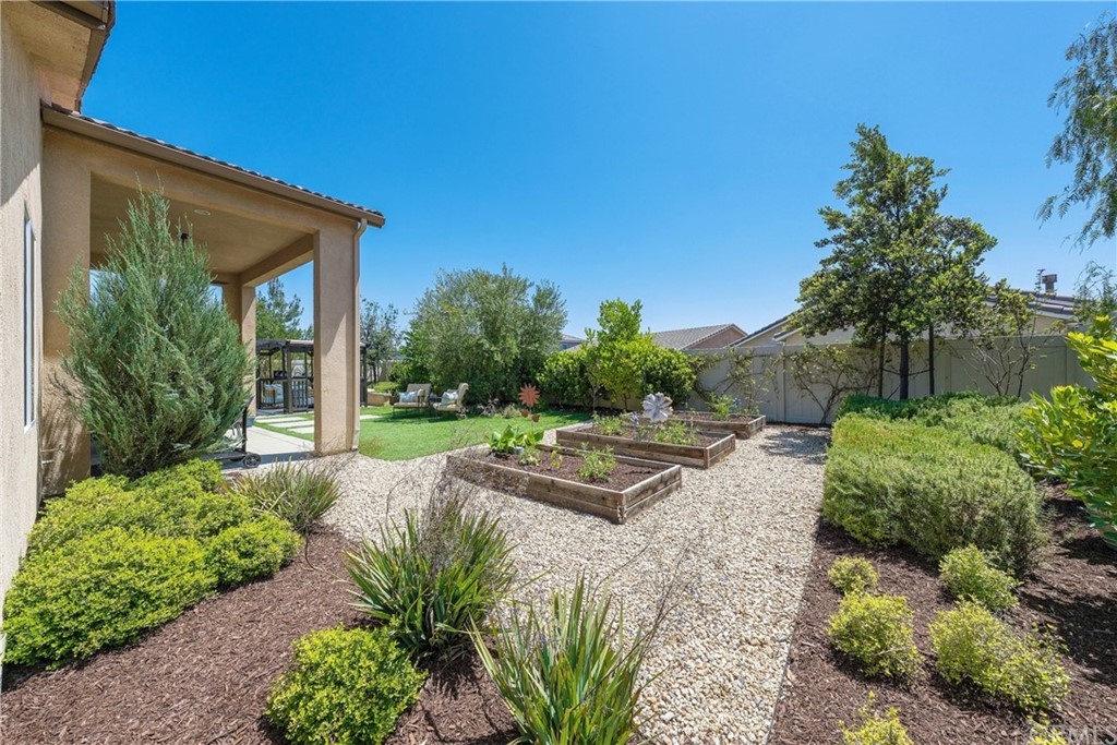 35162 Ladybug Lane Murrieta, CA 92563 - Photo 40 of 58 a view of a house with backyard and garden
