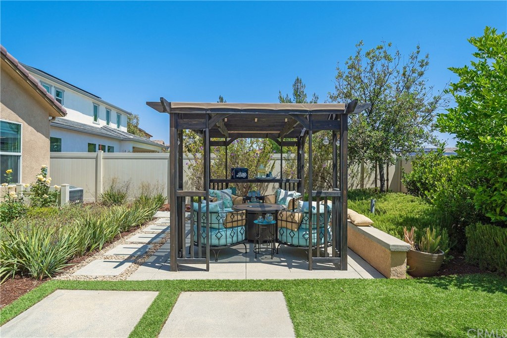 35162 Ladybug Lane Murrieta, CA 92563 - Photo 44 of 58 a view of a chair and table in backyard of the house