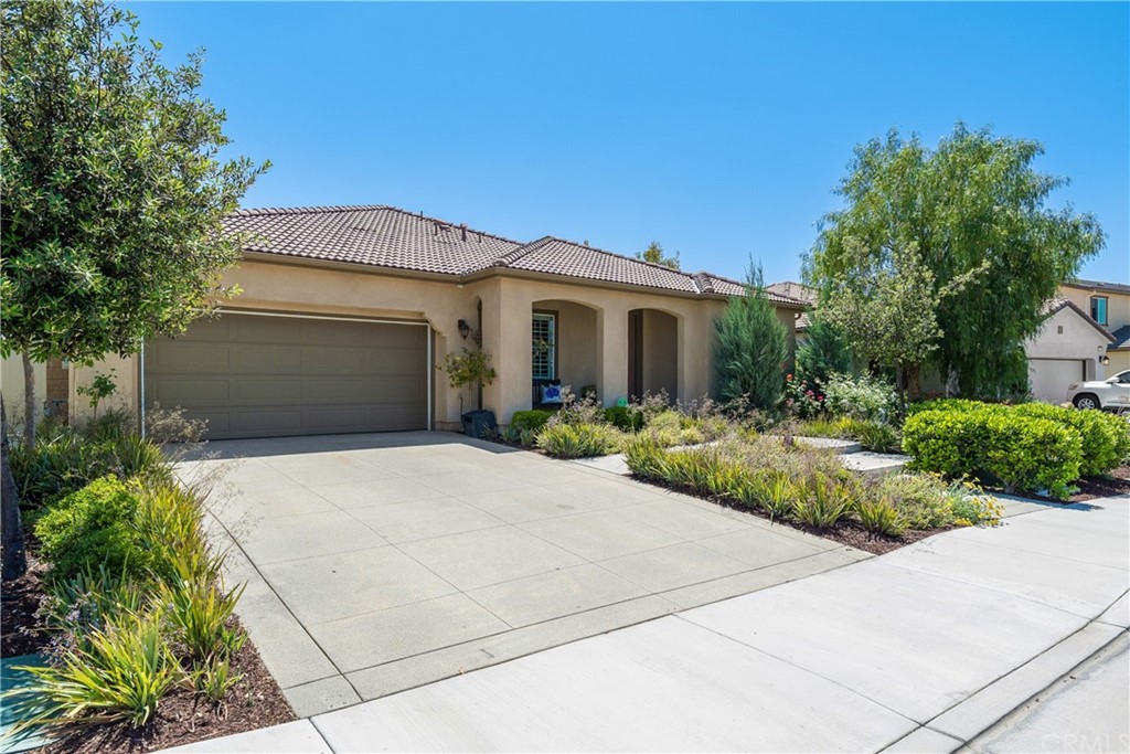 35162 Ladybug Lane Murrieta, CA 92563 - Photo 7 of 58 a front view of a house with garden