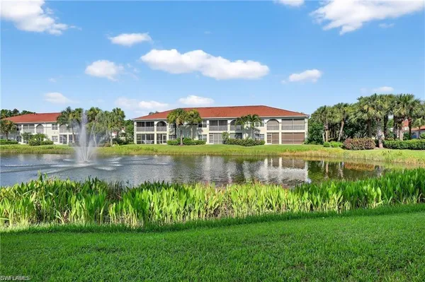 a view of a lake with a big yard