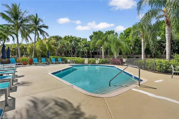 a view of a backyard with garden and patio