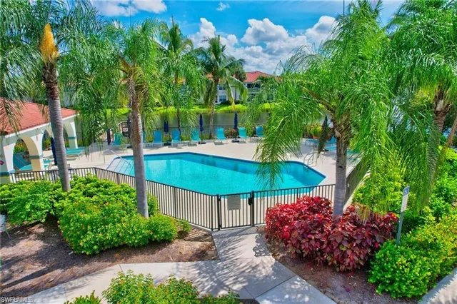 a view of swimming pool from a balcony