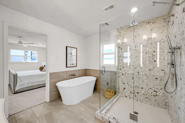 a bathroom with a bathtub and a shower