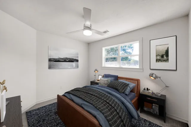 a bedroom with bed and a window