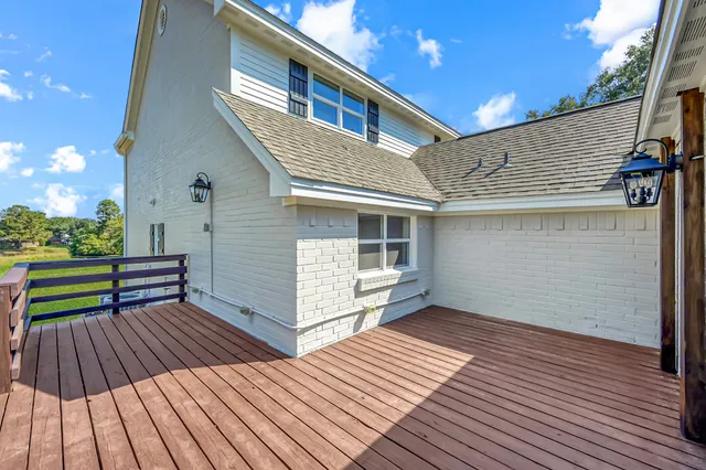 a view of outdoor space with deck and flat screen tv